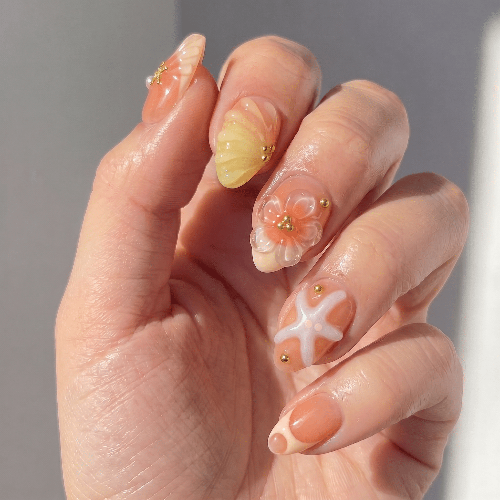 Siren Glaze press-on nails worn on hand – almond shape by Handora
