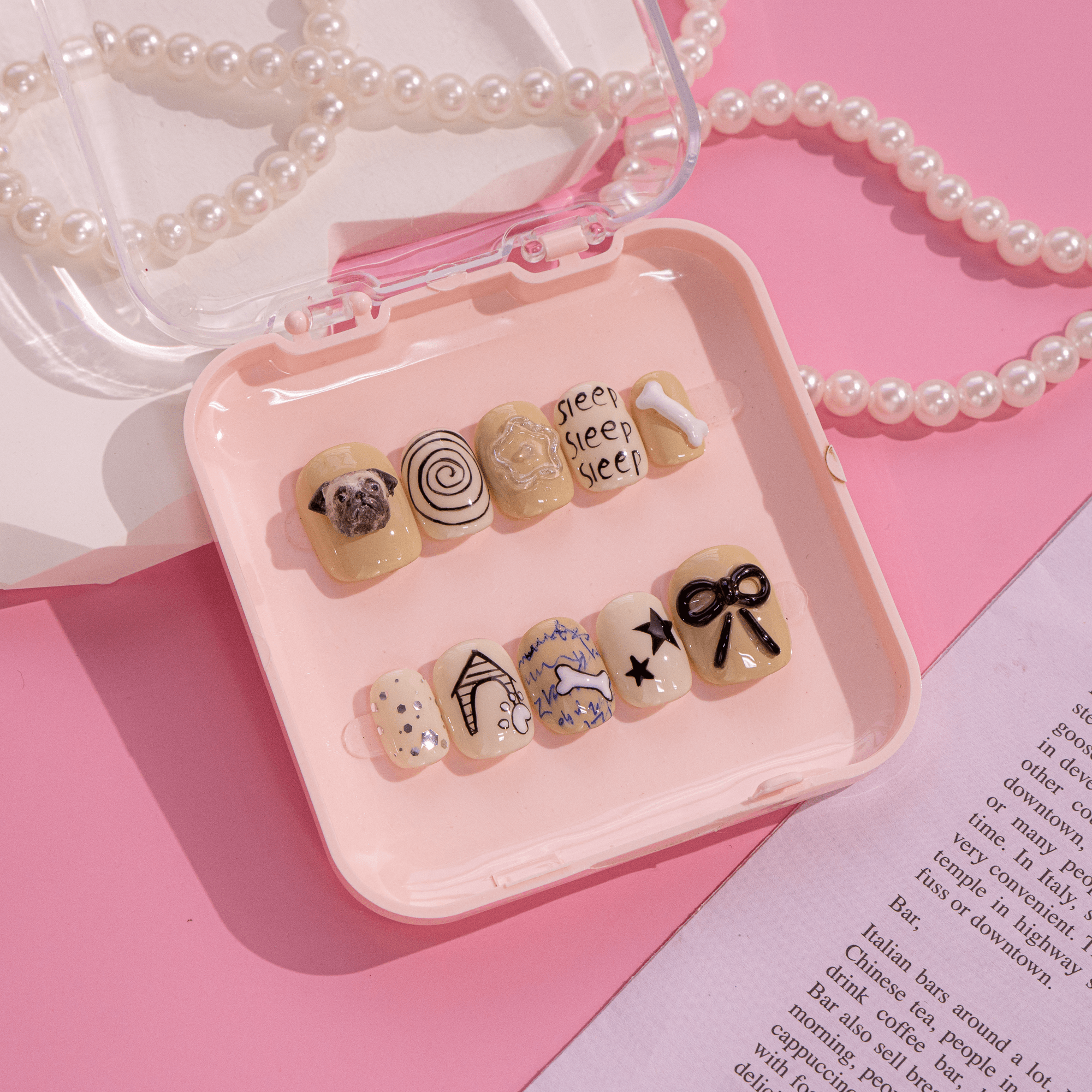 Sleepy Pug press-on nails worn on hand – almond shape by Handora