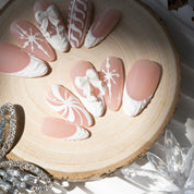 Snowy Chic press-on nails worn on hand – almond shape by Handora