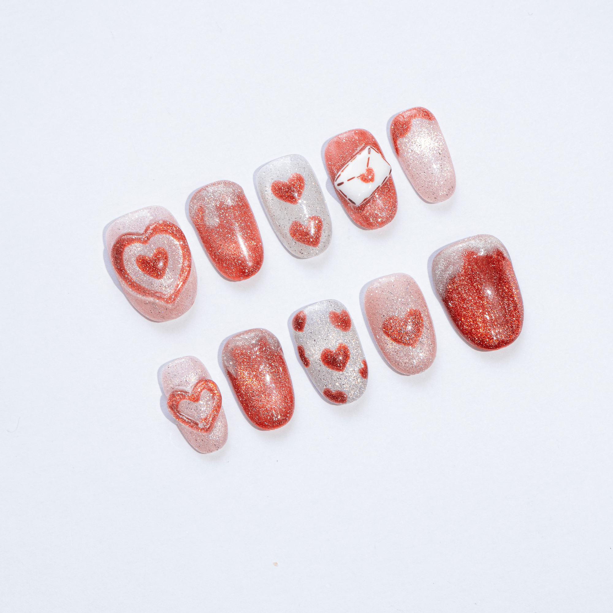 Sparkling Hearts press-on nails – design close-up by Handora
