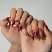 Spider Night press-on nails worn on hand – almond shape by Handora