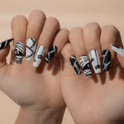Spooky Chic press-on nails worn on hand – almond shape by Handora