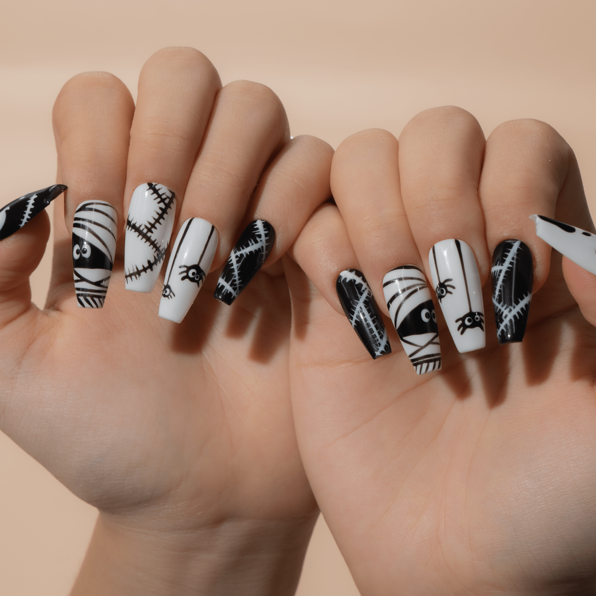 Spooky Chic press-on nails worn on hand – almond shape by Handora