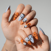 Spooky Drip press-on nails worn on hand – almond shape by Handora