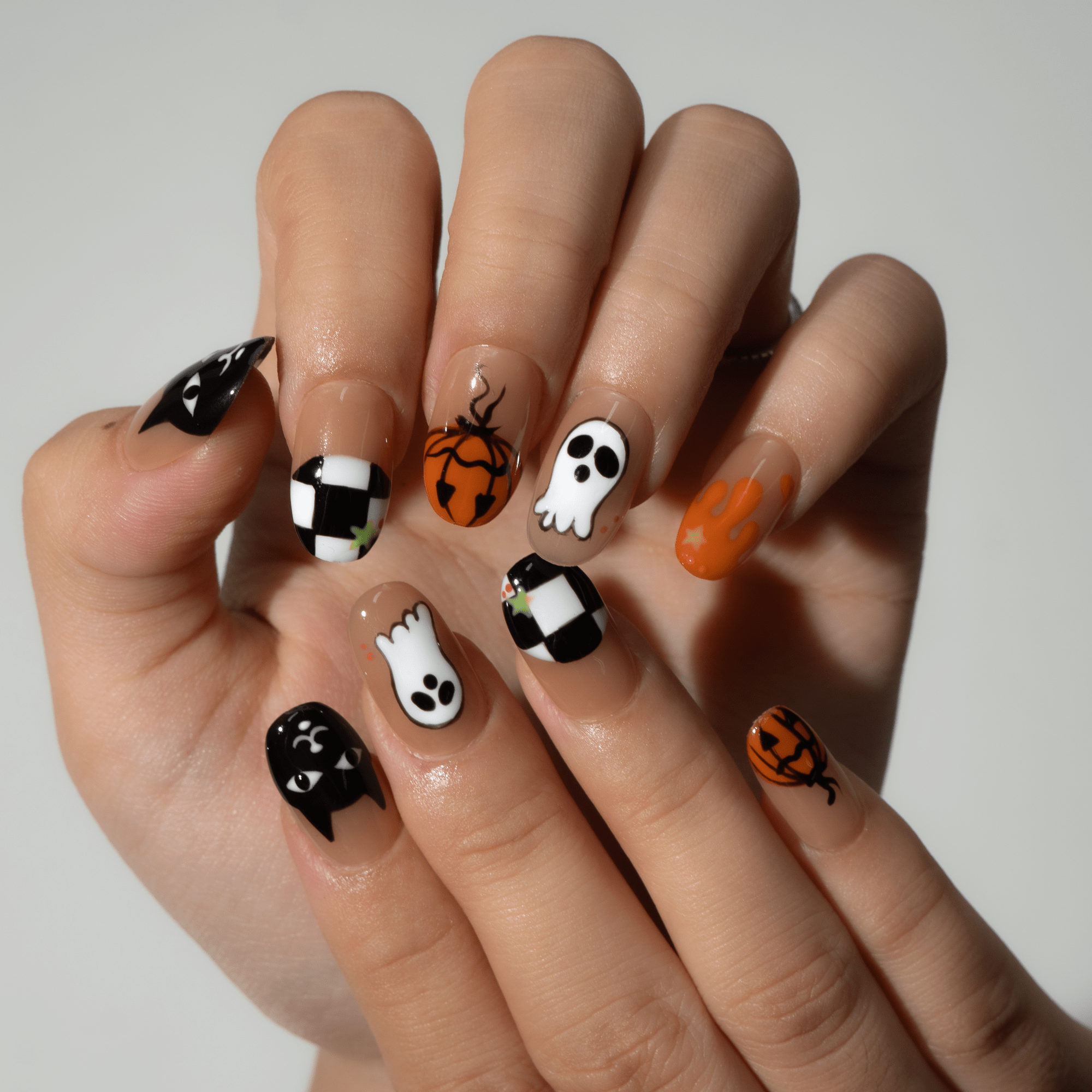 Spooky Night press-on nails worn on hand – almond shape by Handora