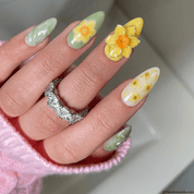 Spring Chrysalis press-on nails worn on hand – almond shape by Handora