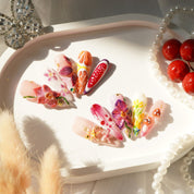 Spring Garden press-on nails worn on hand – almond shape by Handora