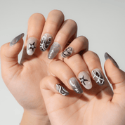 Star Dust press-on nails worn on hand – almond shape by Handora