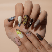 Starfall Dream press-on nails worn on hand – almond shape by Handora