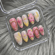 Starry Pink press-on nails worn on hand – almond shape by Handora