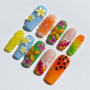 Summer Bloom press-on nails worn on hand – coffin shape by Handora