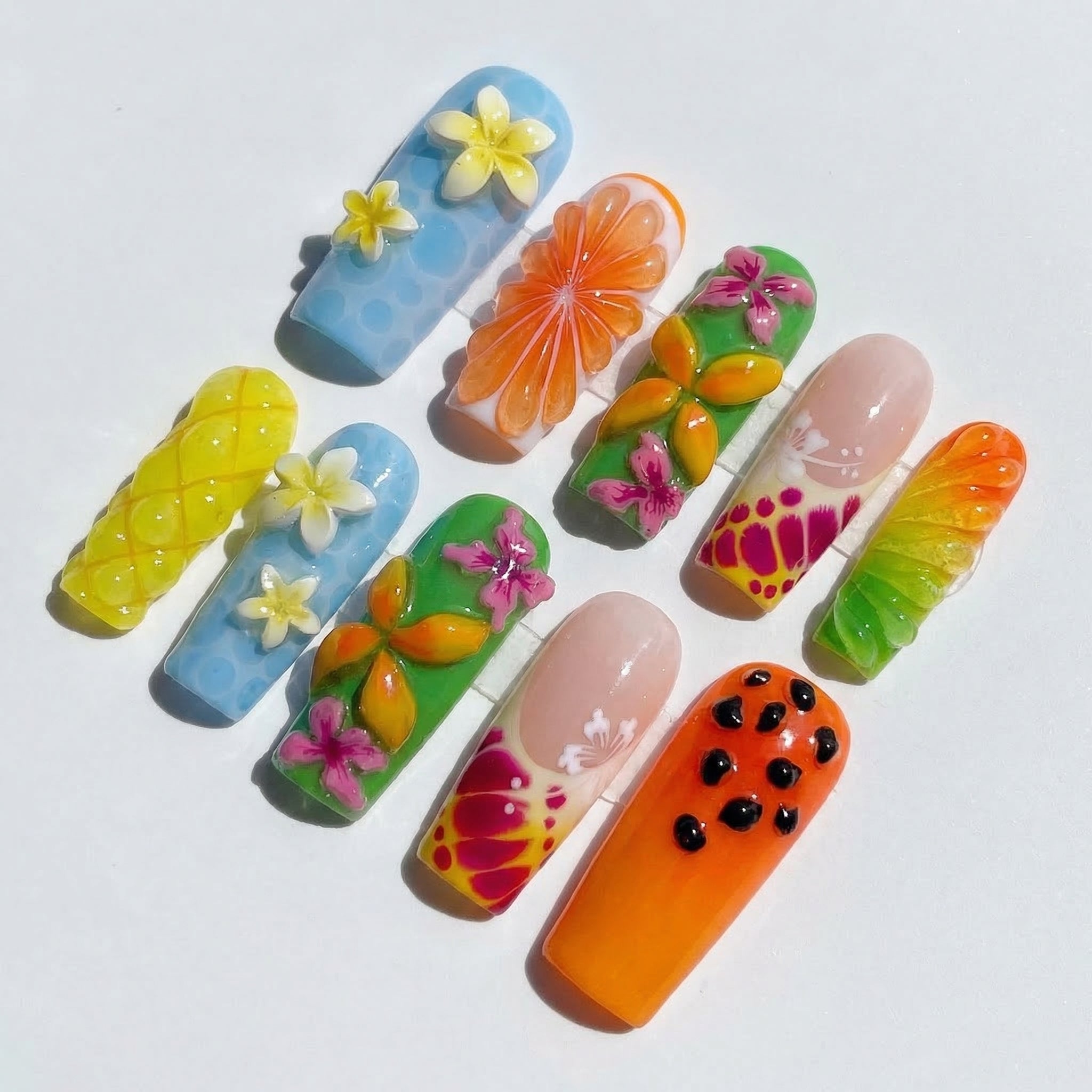 Summer Bloom press-on nails worn on hand – coffin shape by Handora