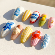 Summer Picnic press-on nails – hand-painted reusable gel set by Handora