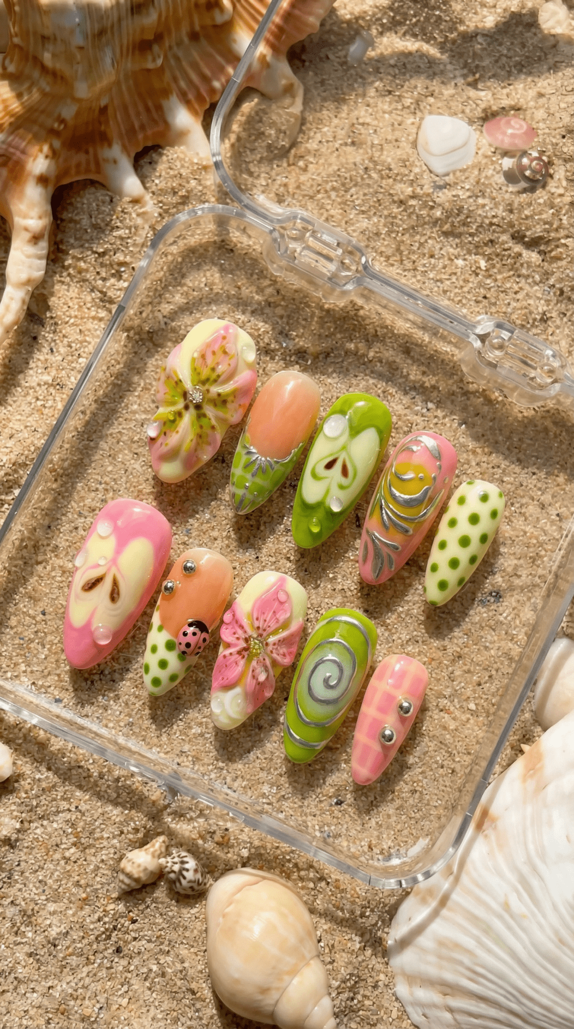Summer Sparkle press-on nails worn on hand – almond shape by Handora