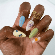 Summer Zest press-on nails worn on hand – almond shape by Handora