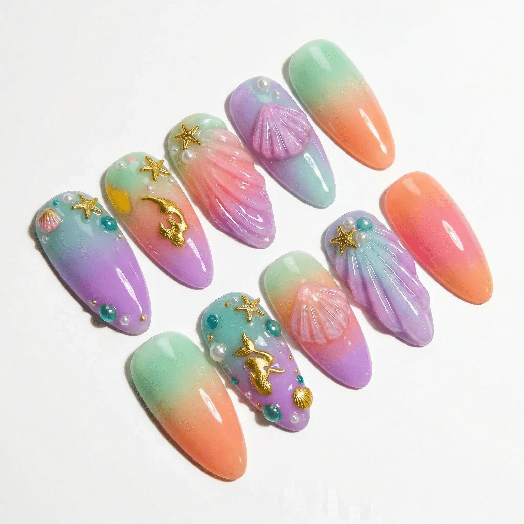 Sunset Mermaid press-on nails worn on hand – almond shape by Handora