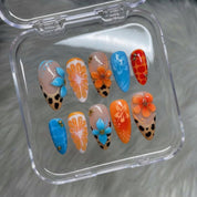 Sunset Safari floral nail design – handmade press-on nails by Handora