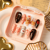 Sweet Dachshund press-on nails worn on hand – almond shape by Handora