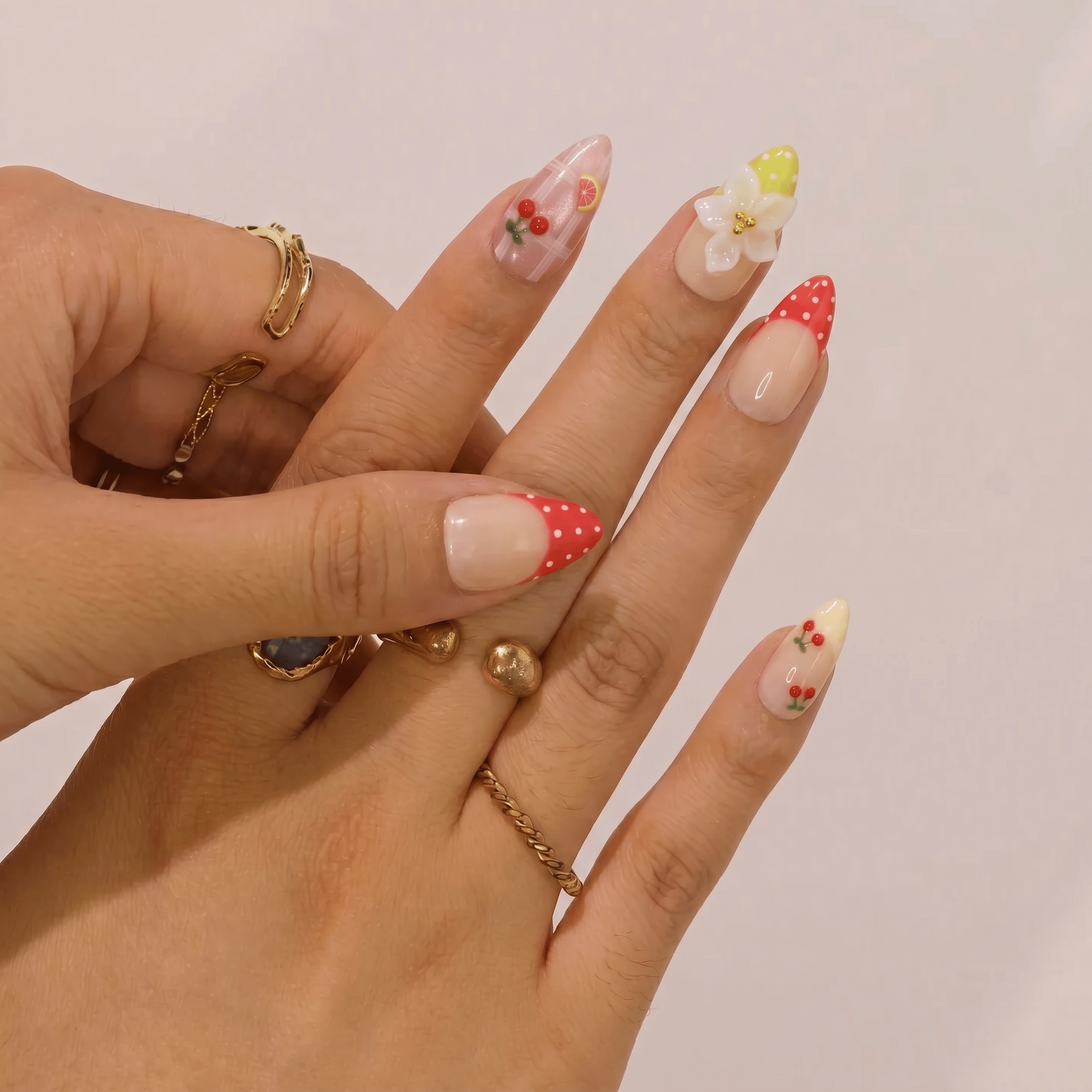 Sweet Orchard press-on nails worn on hand – almond shape by Handora