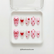 Sweetheart Bow oval press-on nails – design close-up by Handora
