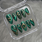 Taurus Bloom press-on nails worn on hand – almond shape by Handora