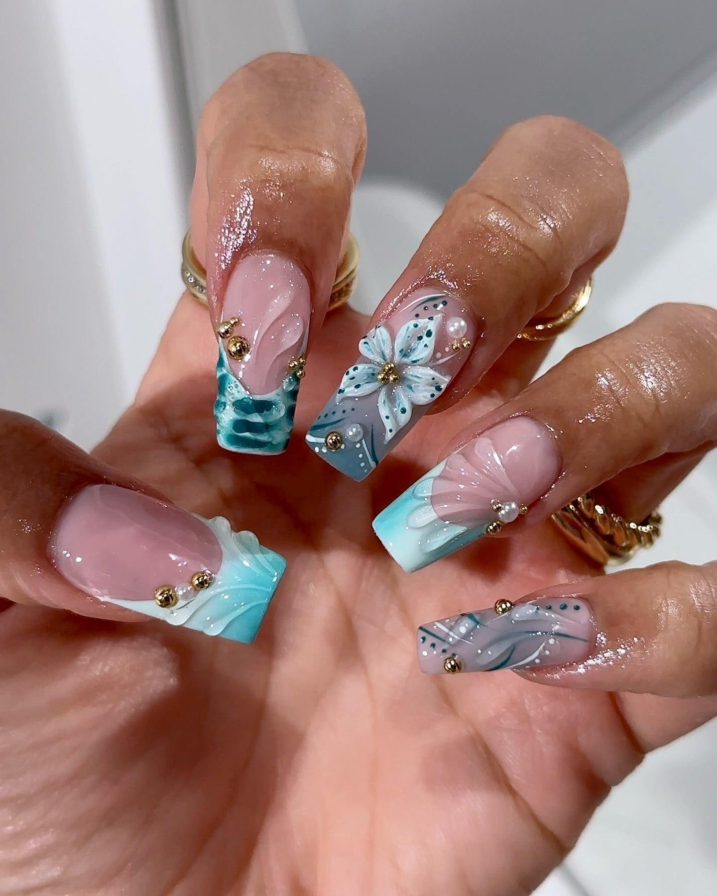 Teal Bloom press-on nails – hand-painted reusable gel set by Handora
