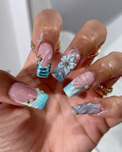Teal Bloom press-on nails – hand-painted reusable gel set by Handora