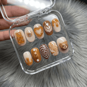 Teddy Latte press-on nails worn on hand – round shape by Handora