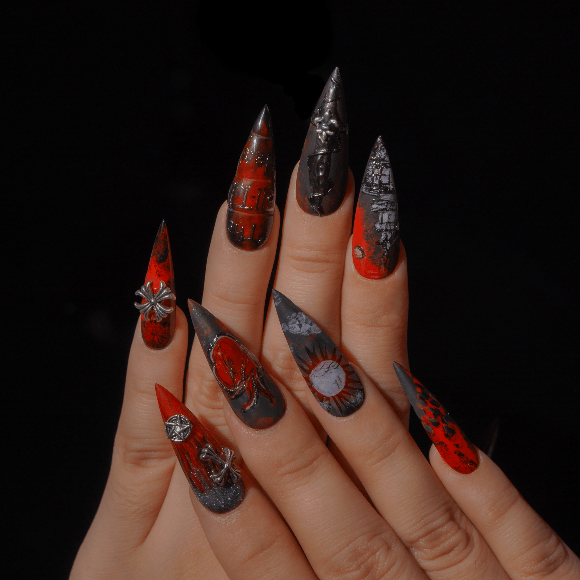 The Tell Tale Heart press-on nails worn on hand – almond shape by Handora