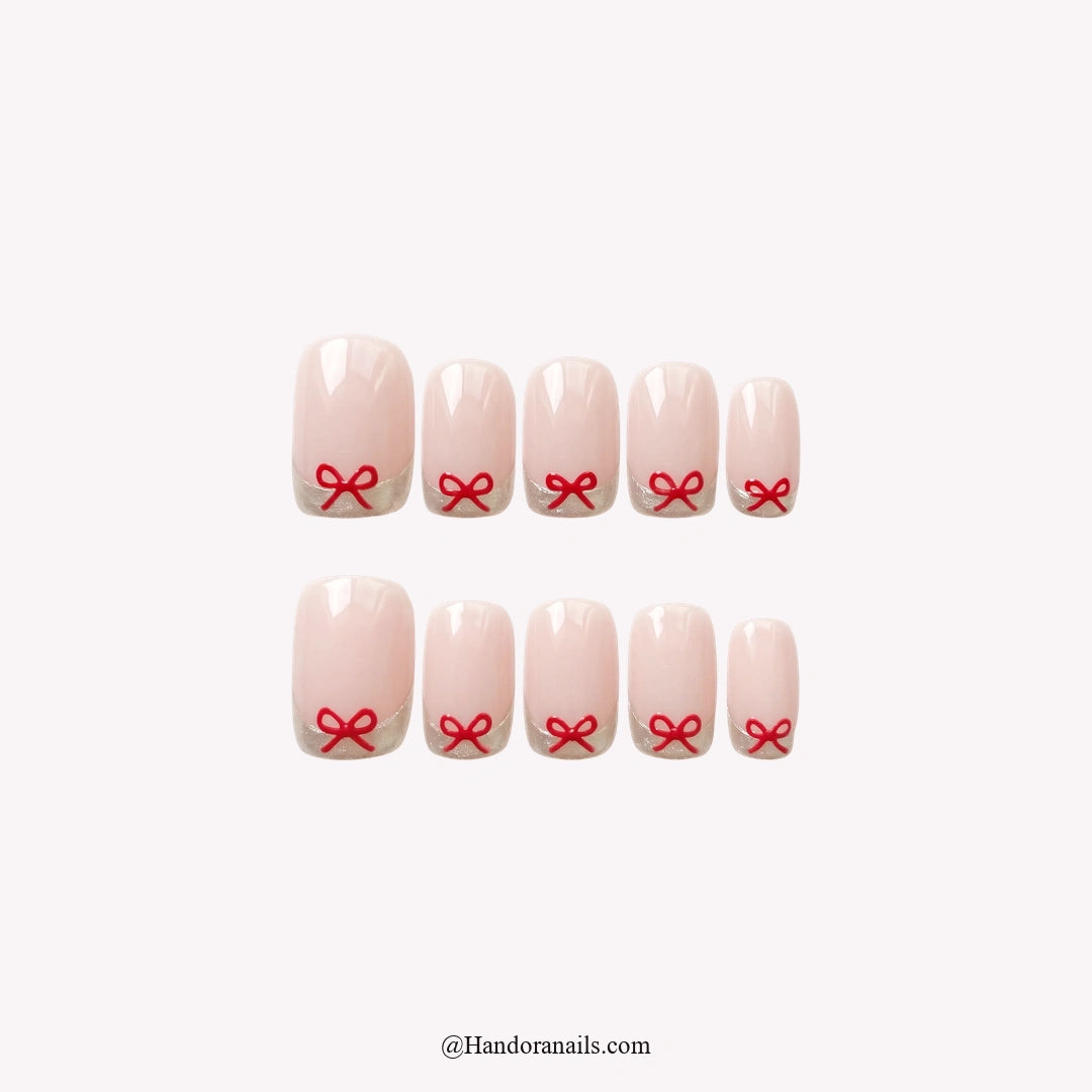 Tiny Bows Christmas press-on nails - white background by Handora Nails