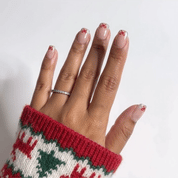 Tiny Bows Christmas press-on nails - moving hand by Handora Nails