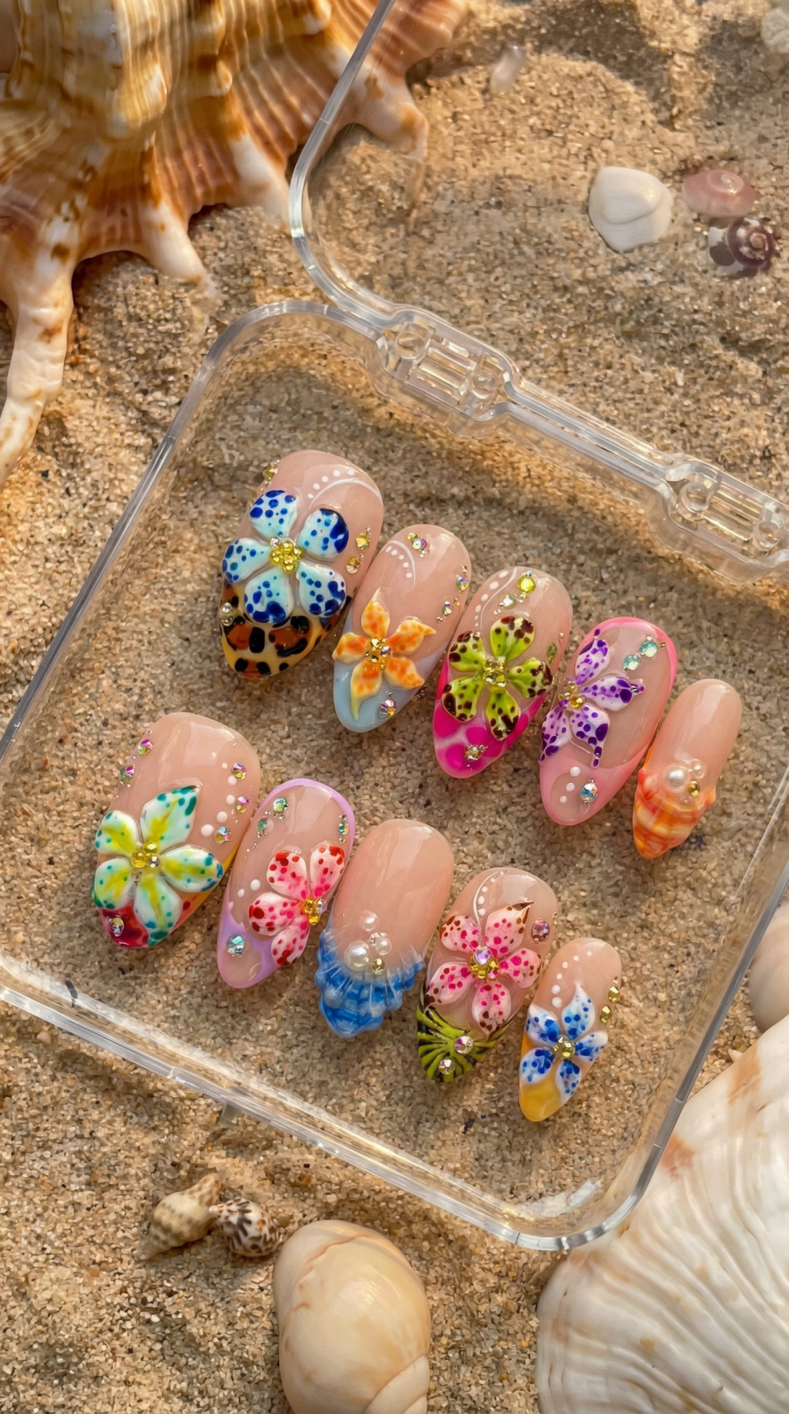 Tropical Floral press-on nails worn on hand – almond shape by Handora
