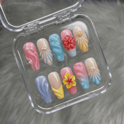 Tropical Pearl press-on nails worn on hand – coffin shape by Handora