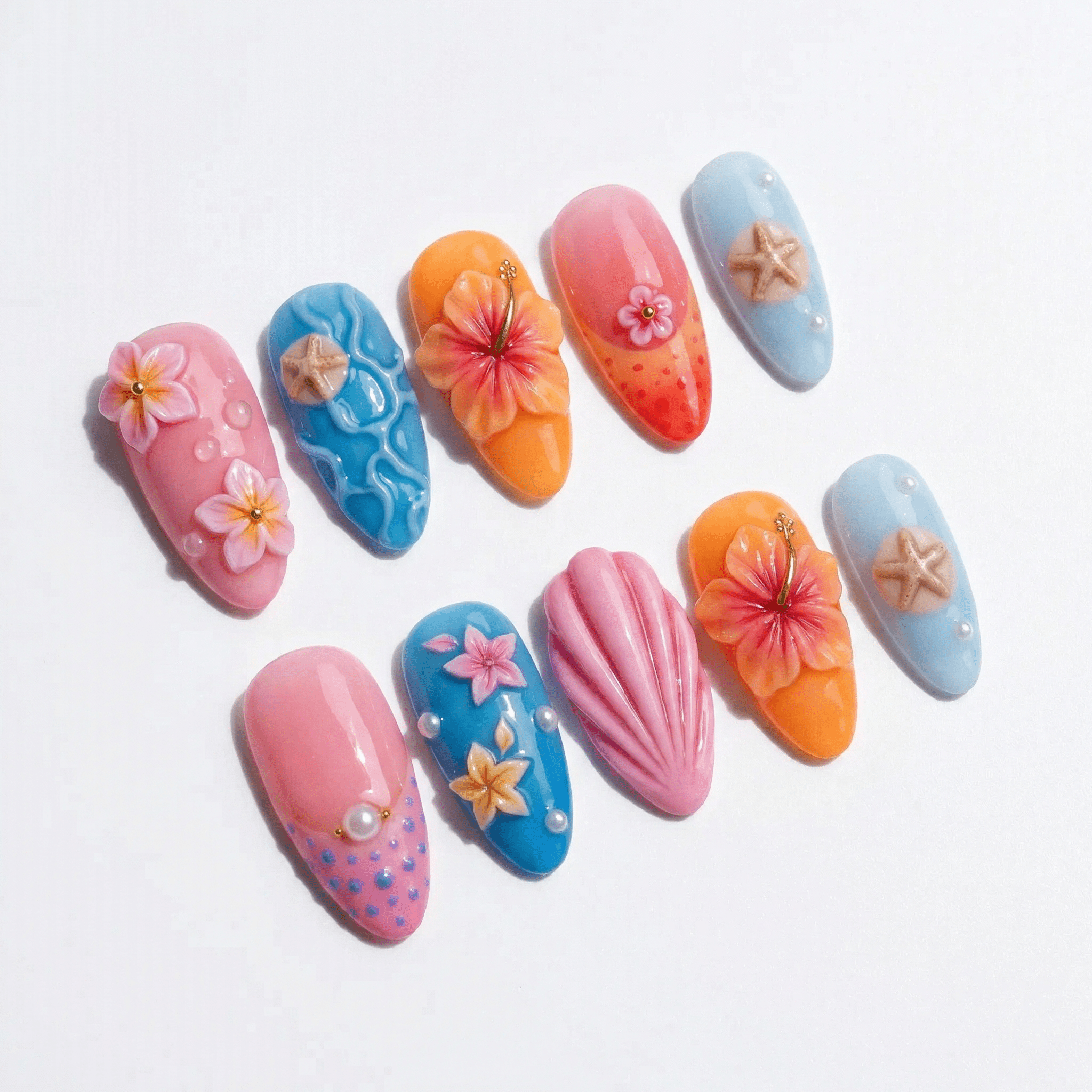 Tropical Shell press-on nails worn on hand – almond shape by Handora