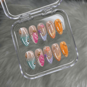 Tropical Siren press-on nails worn on hand – almond shape by Handora