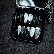 Vampire Chrome press-on nails worn on hand – almond shape by Handora
