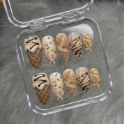 Vanilla Dream press-on nails worn on hand – almond shape by Handora