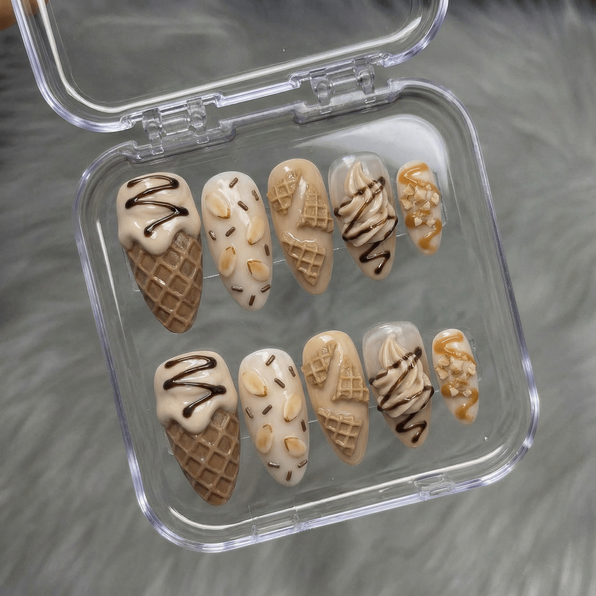 Vanilla Dream press-on nails worn on hand – almond shape by Handora
