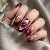 Velvet Aura press-on nails worn on hand – coffin shape by Handora