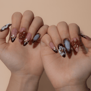 Velvet Bloom press-on nails worn on hand – almond shape by Handora