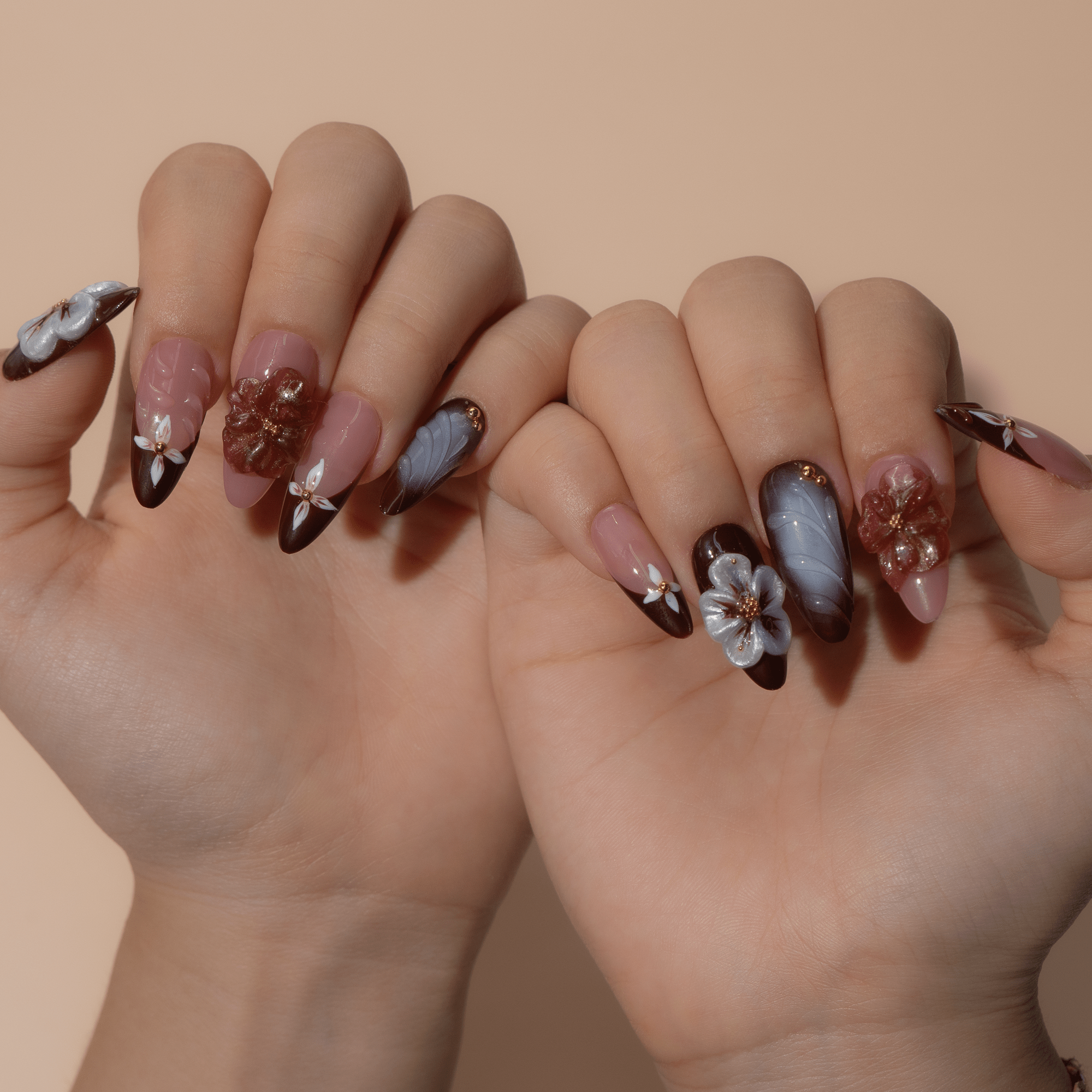 Velvet Bloom press-on nails worn on hand – almond shape by Handora