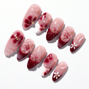 Velvet Nectar press-on nails worn on hand – almond shape by Handora