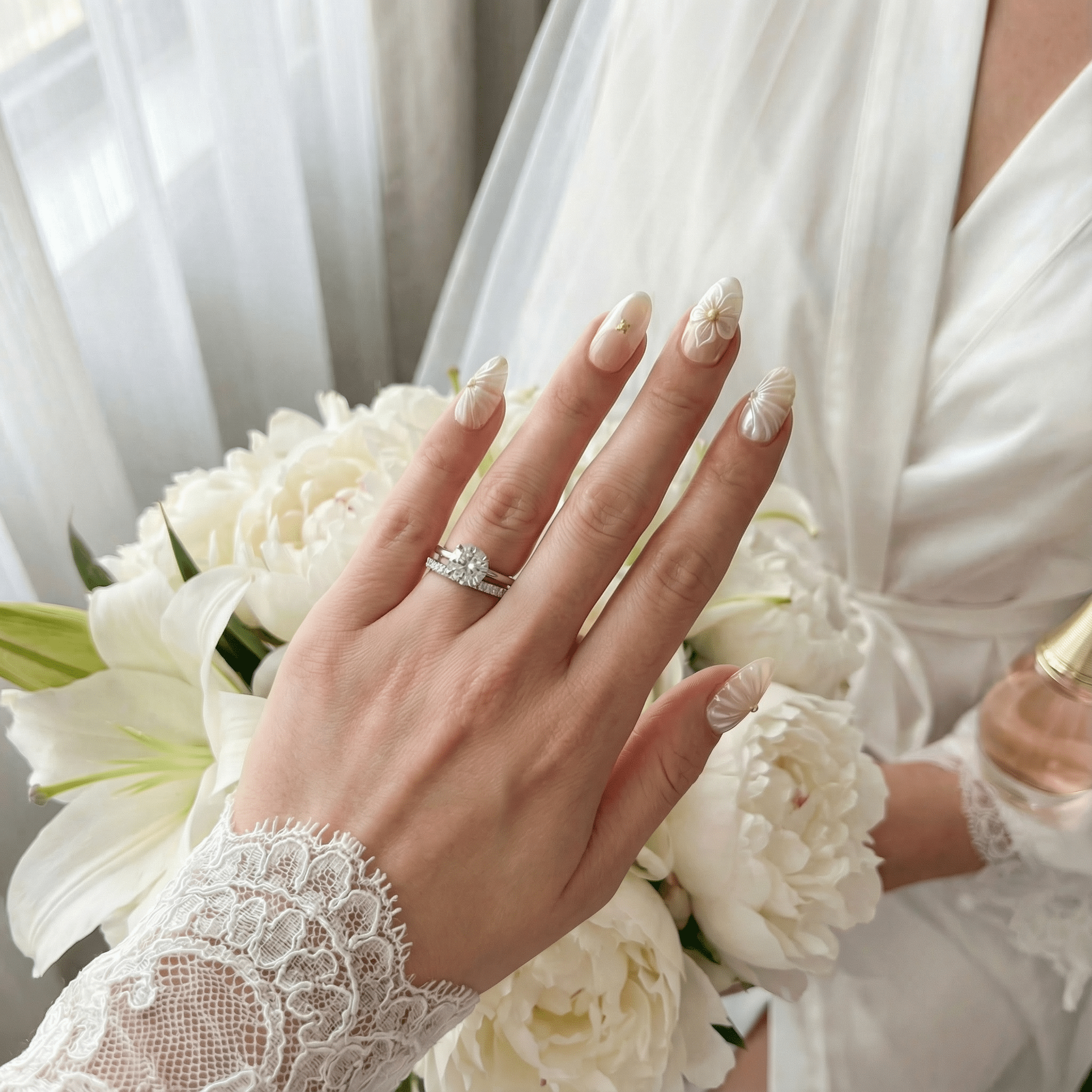 Venus Pearl press-on nails worn on hand – almond shape by Handora