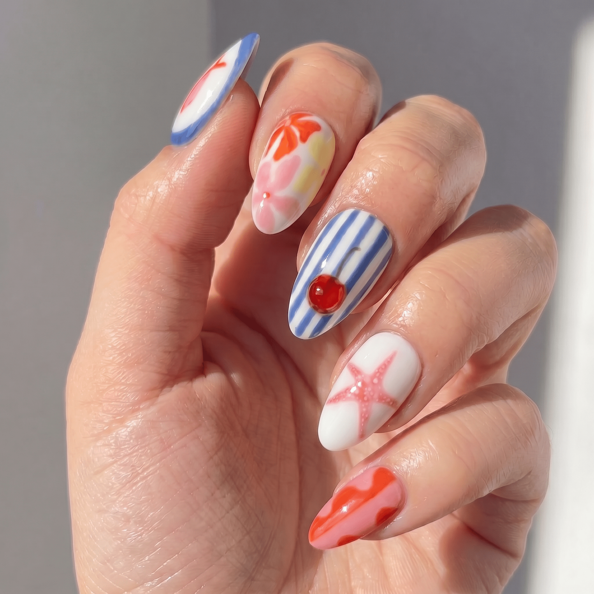 Vibrant Summer press-on nails – hand-painted reusable gel set by Handora