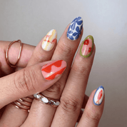 Vibrant Summer press-on nails worn on hand – almond shape by Handora