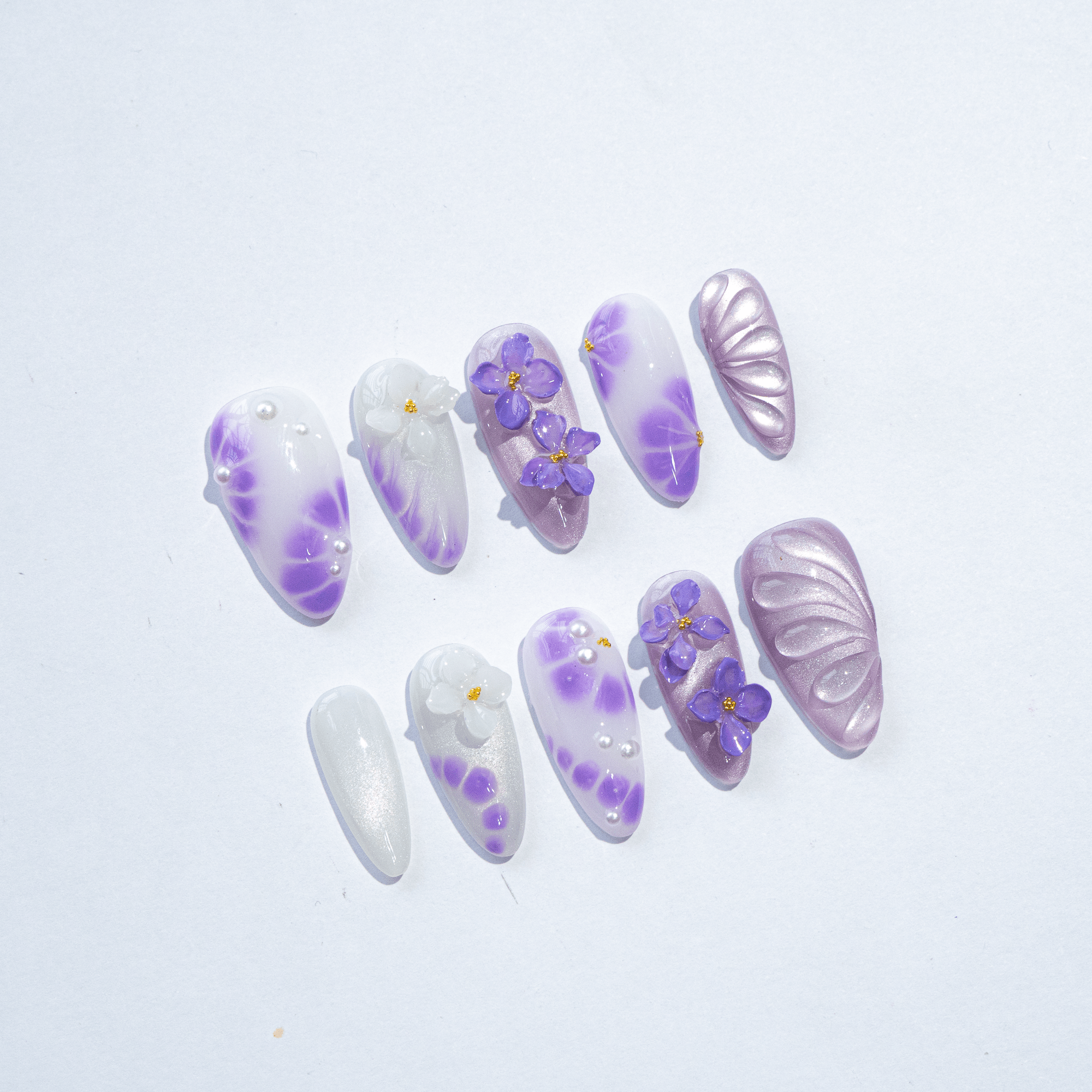 Violet Bloom almond press-on nails – design close-up by Handora