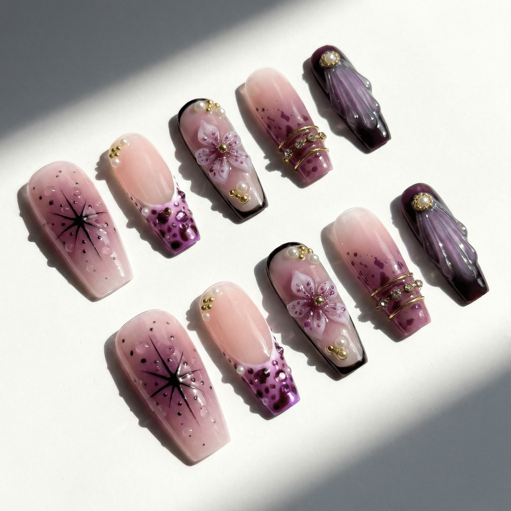 Violet Dream press-on nails worn on hand – coffin shape by Handora