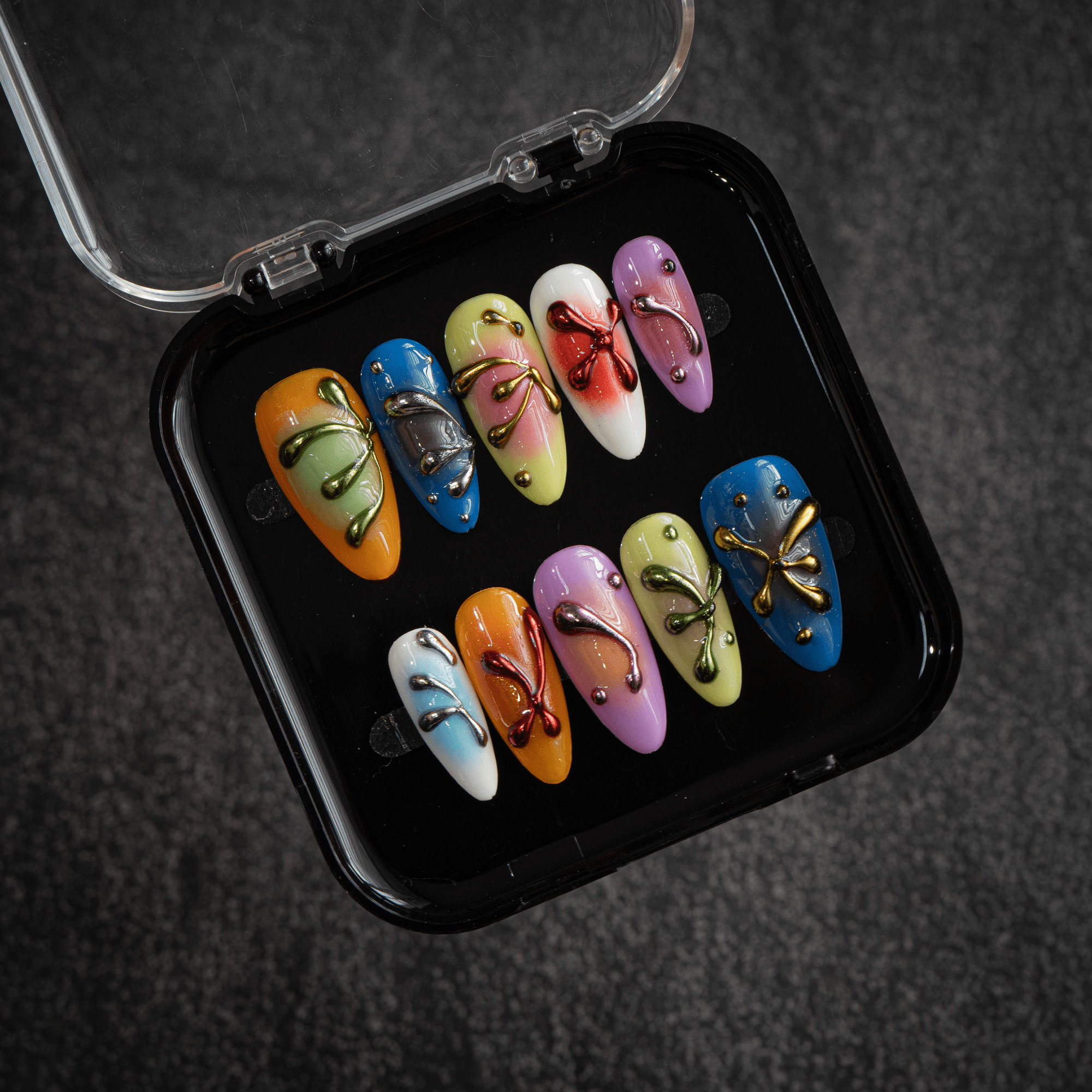 Vivid Liquid almond press-on nails – design close-up by Handora