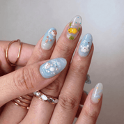 Water Friends press-on nails worn on hand – almond shape by Handora